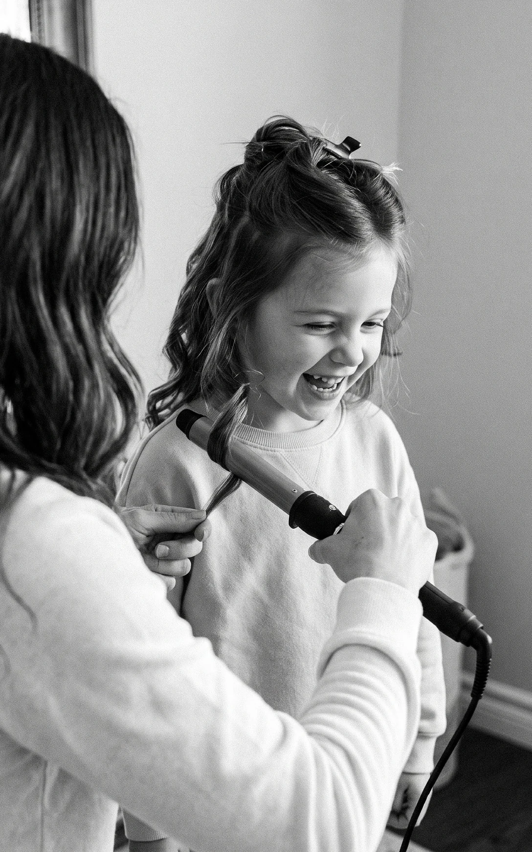 Blow-drying a girl's hair at home